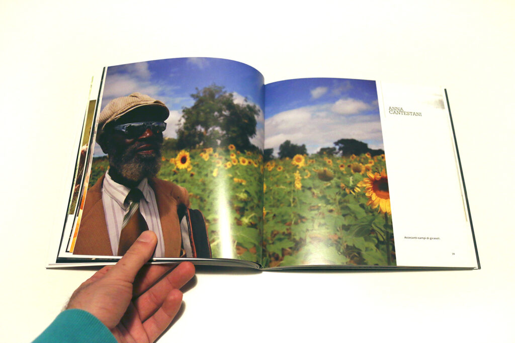 internal page with a photograph of a man with sunglass in a sunflower field